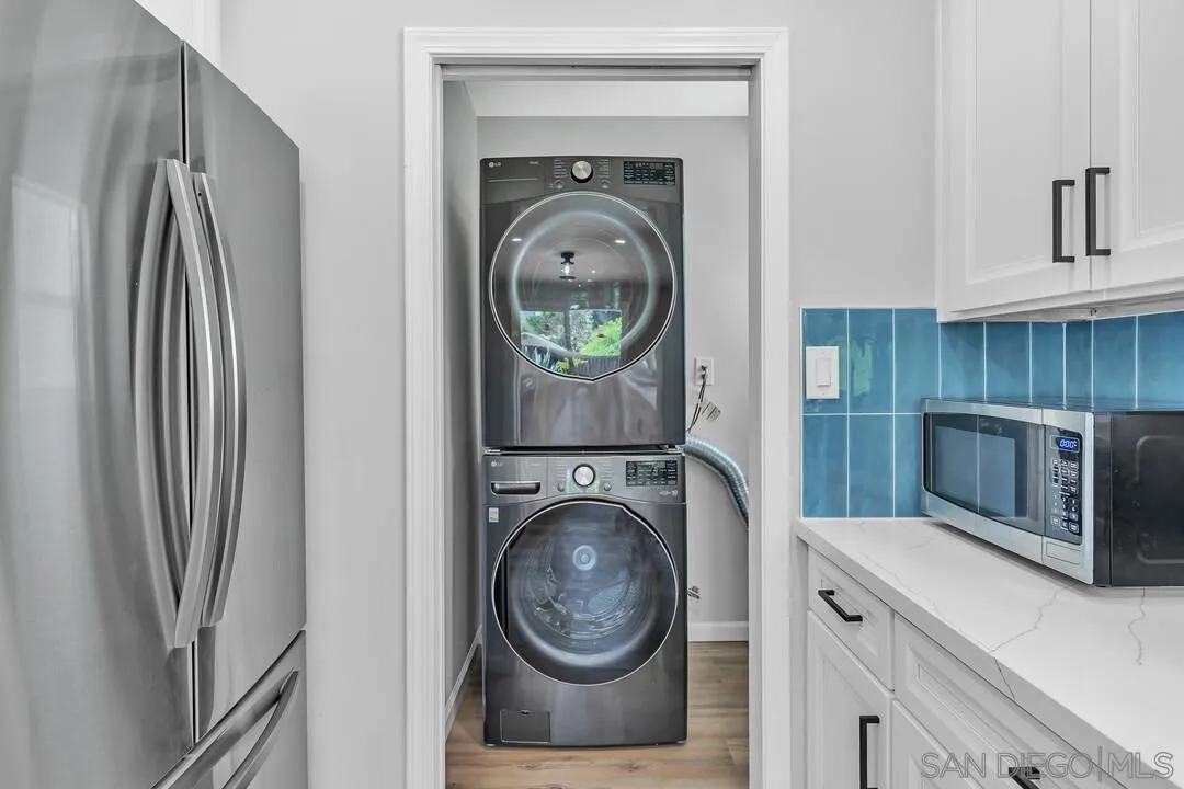 12208 Witt Road Poway, CA 92064 - Photo 15 of 43 a kitchen with a refrigerator sink and cabinets