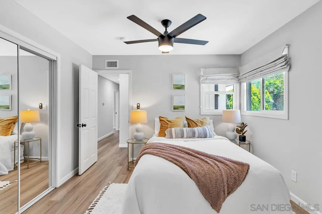 12208 Witt Road Poway, CA 92064 - Photo 18 of 43 a bedroom with a bed and large windows