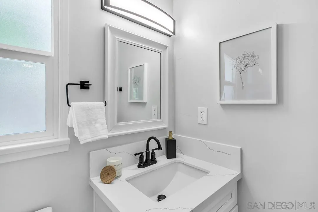 12208 Witt Road Poway, CA 92064 - Photo 21 of 43 a bathroom with a sink and a mirror