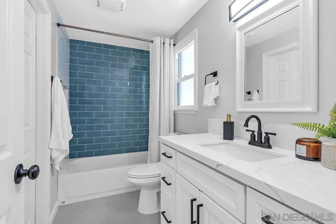 12208 Witt Road Poway, CA 92064 - Photo 26 of 43 a bathroom with a sink a toilet and a bathtub