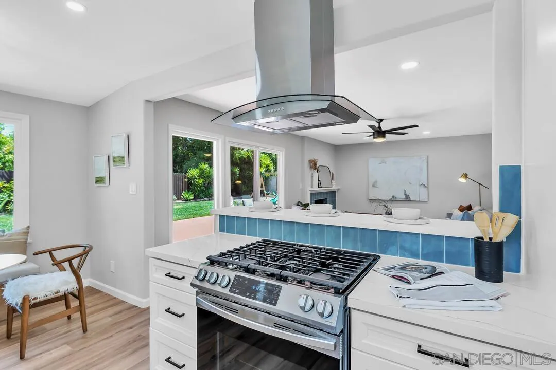 12208 Witt Road Poway, CA 92064 - Photo 10 of 43 a kitchen with stainless steel appliances granite countertop a sink stove and cabinets
