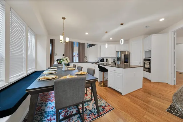 a kitchen with sink refrigerator and microwave