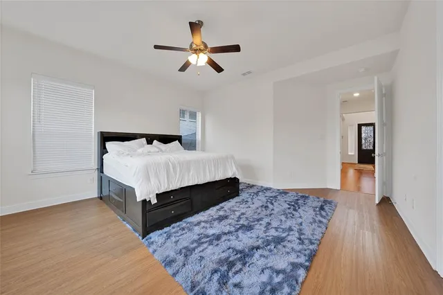 a bedroom with a bed and window