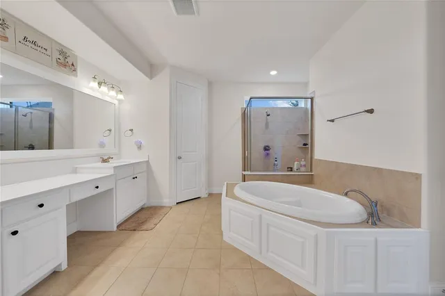 a bathroom with a tub and a shower
