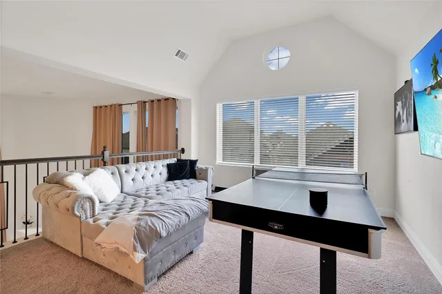 a spacious bedroom with a bed and a table