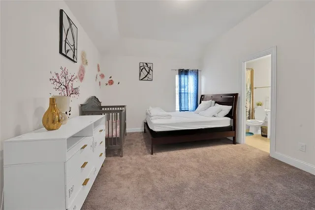 a bedroom with a bed and dresser