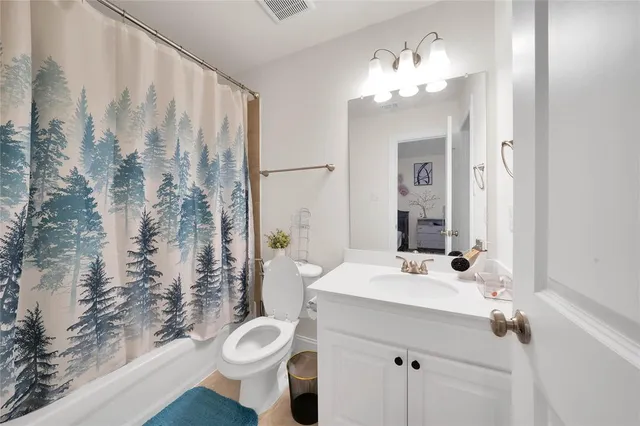 a bedroom with a bed and dresser