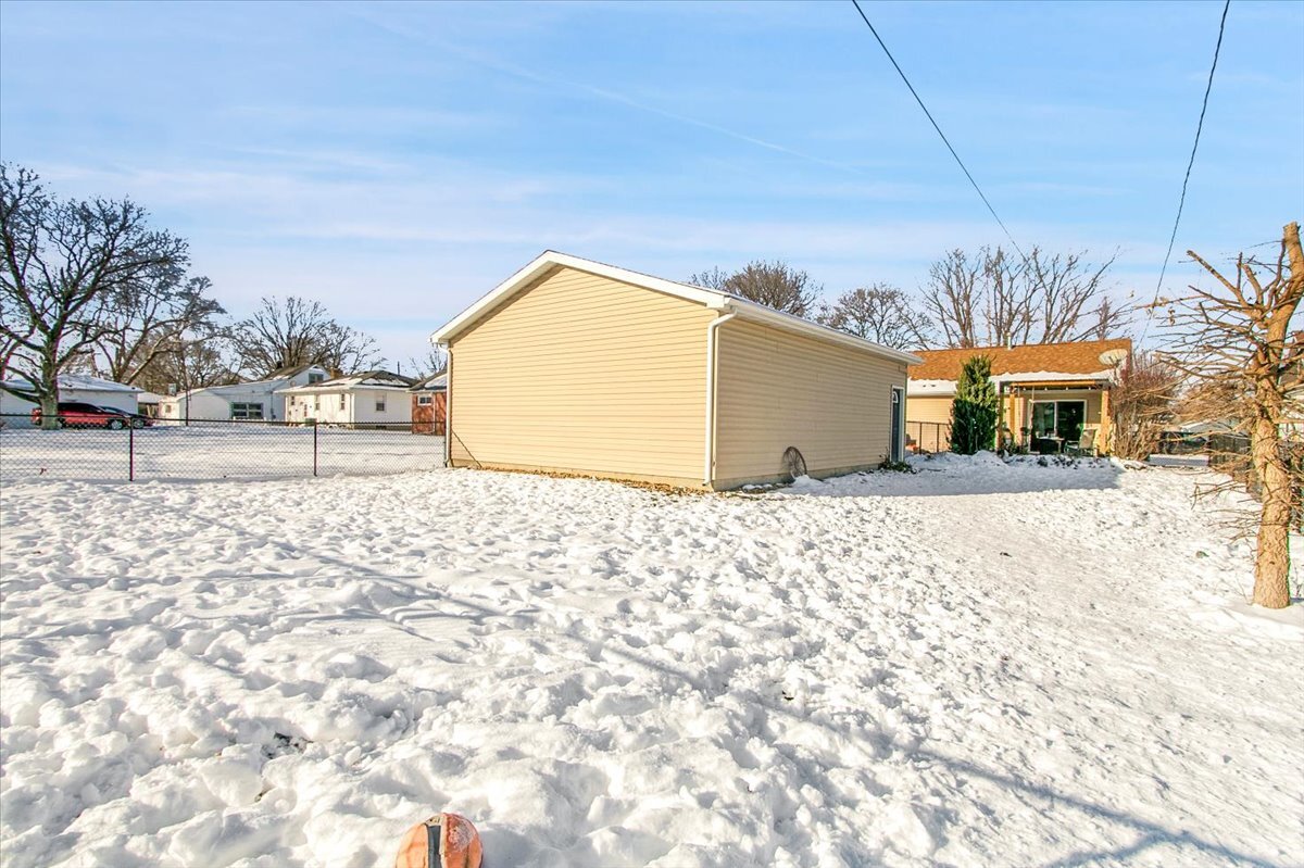 1203 Riverside Avenue Streator, IL 61364 - Photo 14 of 15 a view of a house with a snow