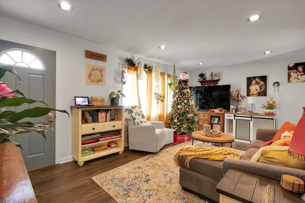 a living room with furniture and a flat screen tv