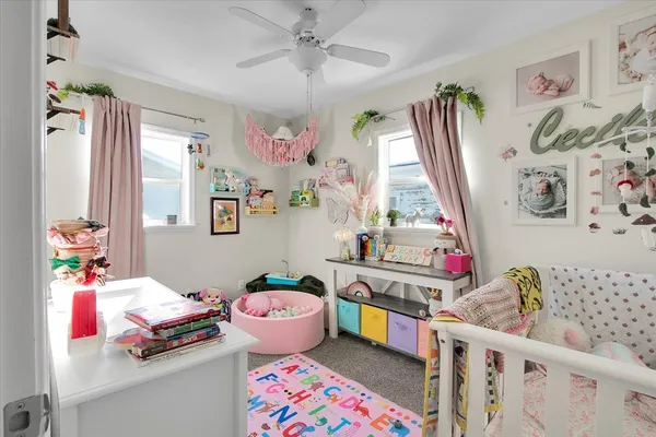 a bedroom with furniture and a window