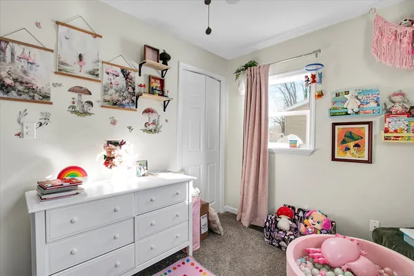 a bedroom with a bed and cabinets