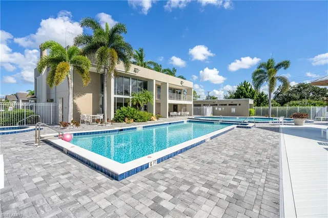 a view of swimming pool with a patio