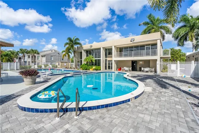 a view of a swimming pool with a patio