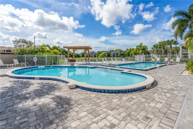 a view of a swimming pool with a yard