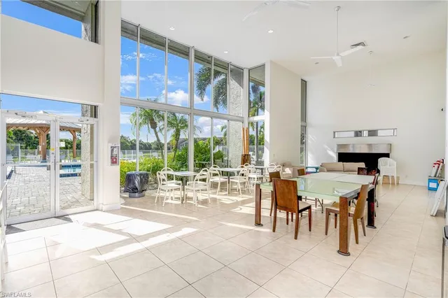 a view of a dining hall with lots of tables and chairs