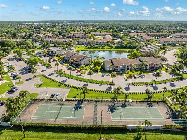 a view of a park with swings and slides