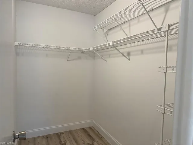 a view of a room with racks on the wall