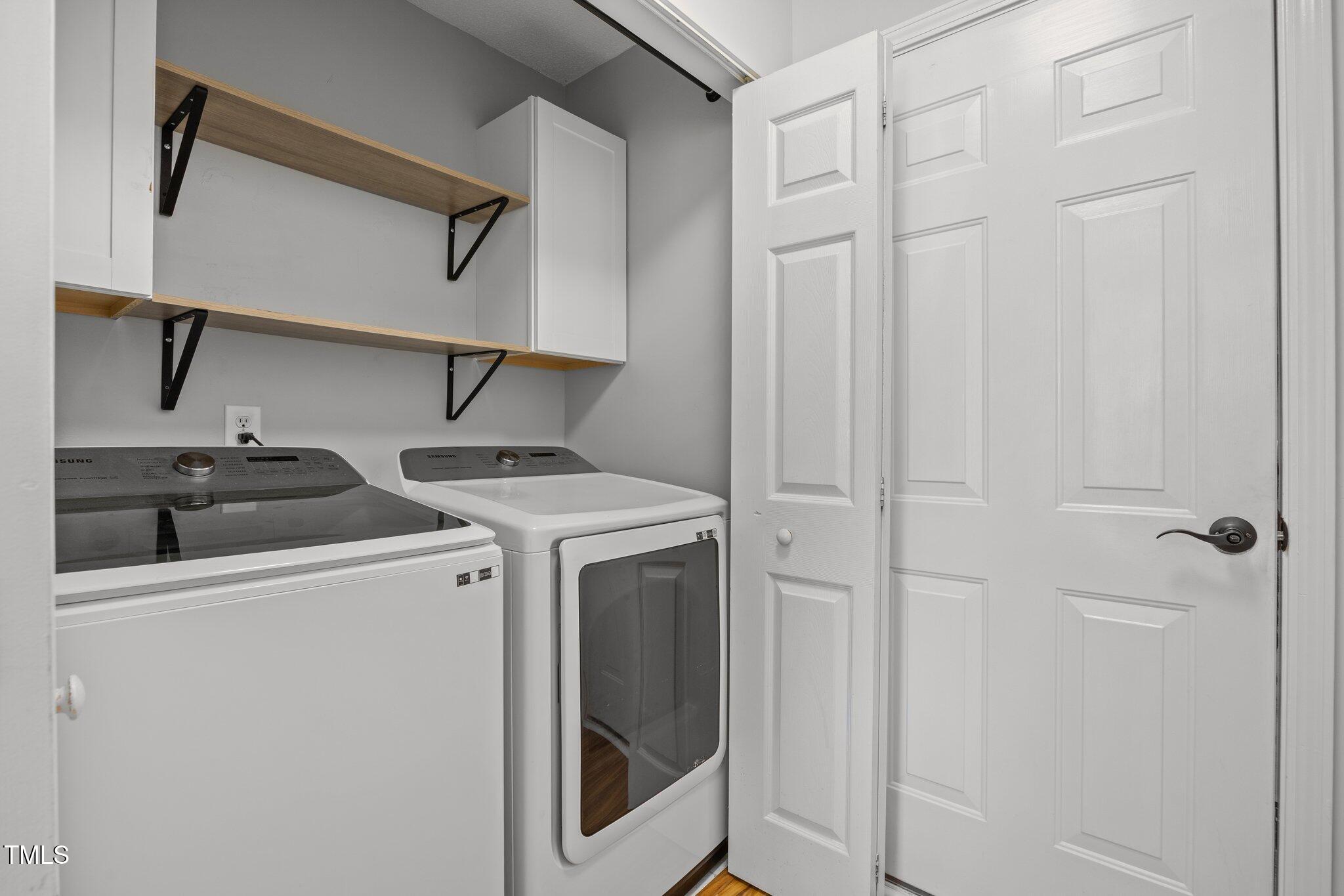 5300 Roan Mountain Place Raleigh, NC 27613 - Photo 14 of 27 a utility room with dryer and washer