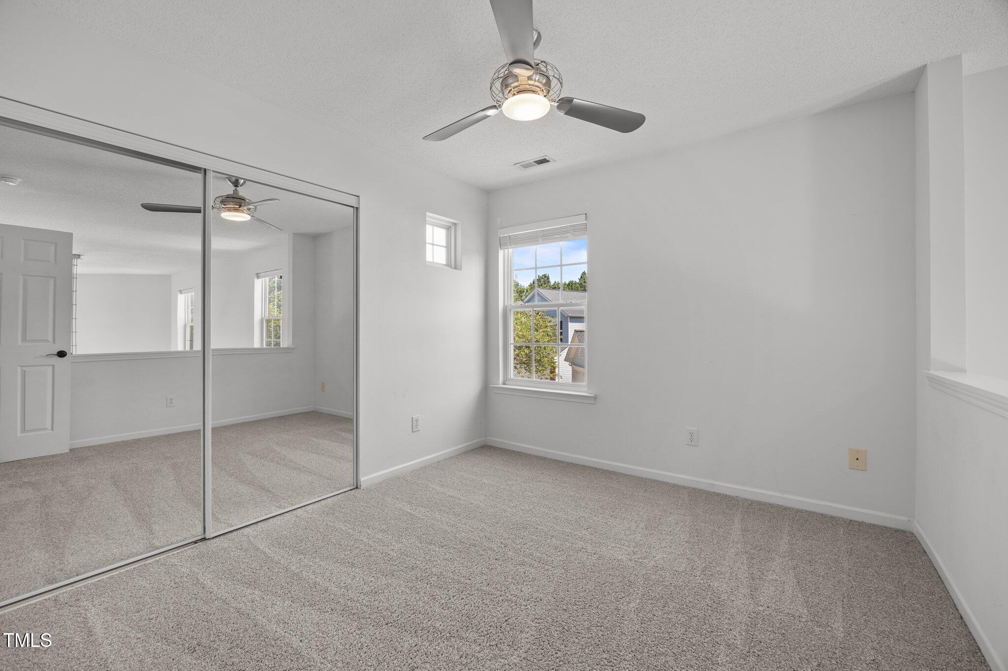 5300 Roan Mountain Place Raleigh, NC 27613 - Photo 22 of 27 a view of an empty room with a window
