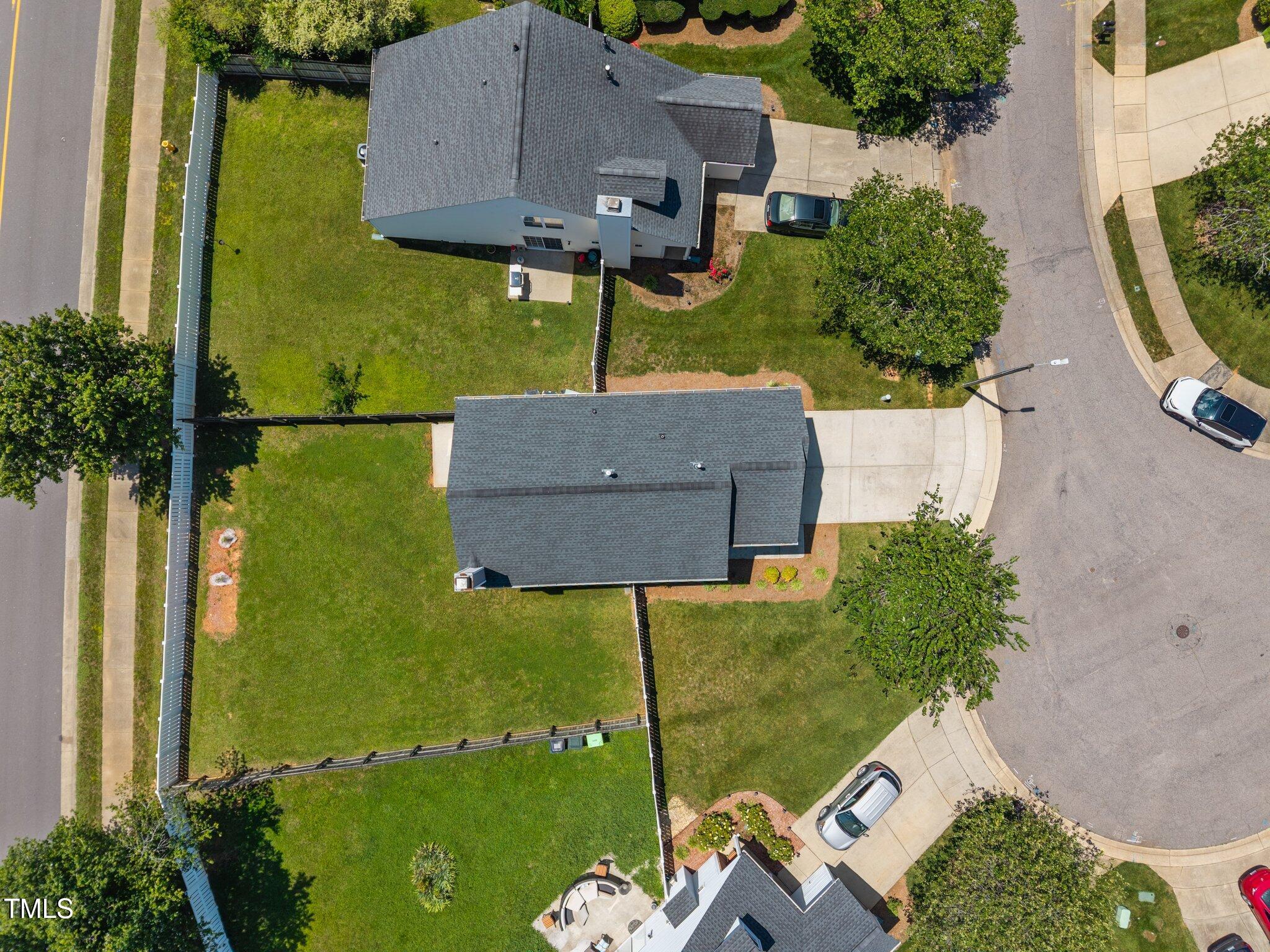 5300 Roan Mountain Place Raleigh, NC 27613 - Photo 24 of 27 an aerial view of a house having yard