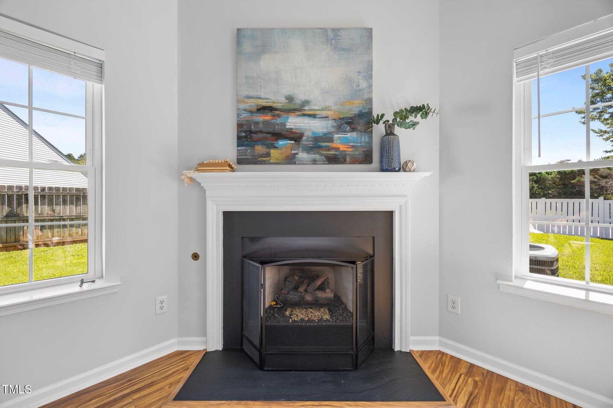 5300 Roan Mountain Place Raleigh, NC 27613 - Photo 6 of 27 a living room with furniture and a fireplace