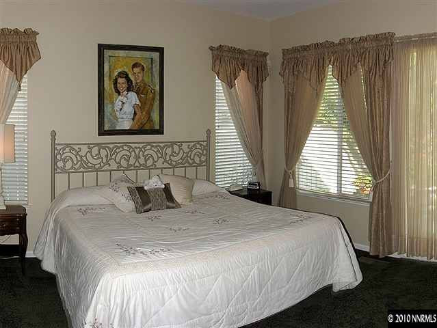 1580 Caughlin Creek Road Reno, NV 89519 - Photo 6 of 9 a bedroom with bed and wall painting with wooden floor