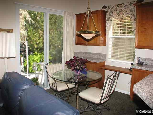 1580 Caughlin Creek Road Reno, NV 89519 - Photo 8 of 9 a living room with furniture and a floor to ceiling window