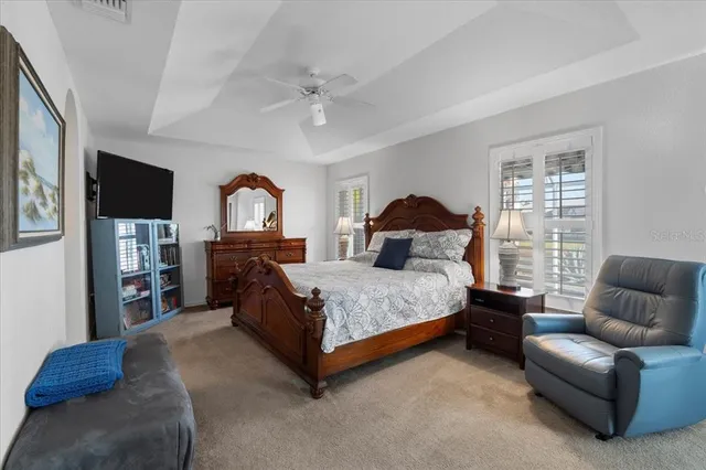 a bedroom with a large bed and a couch