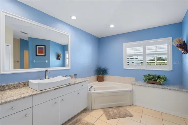 a kitchen that has a sink and a stove