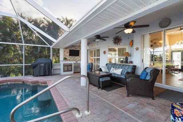 a view of a patio with a table and chairs