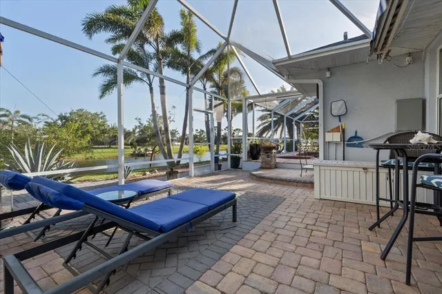 an aerial view of residential houses with outdoor space and ocean view