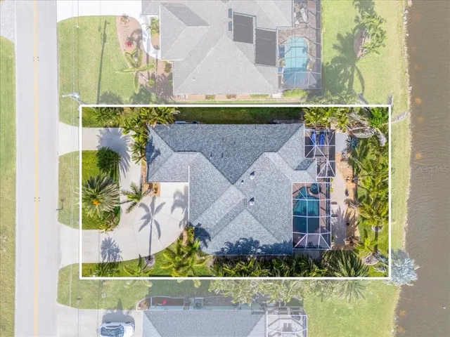 an aerial view of houses with yard