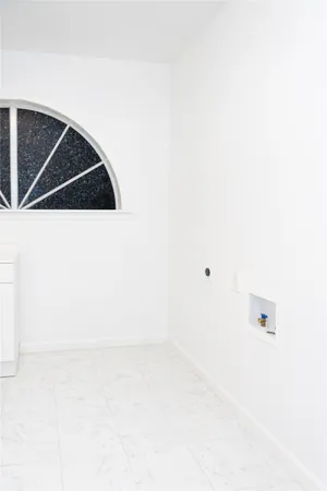 a view of a balcony with wooden floor and fence