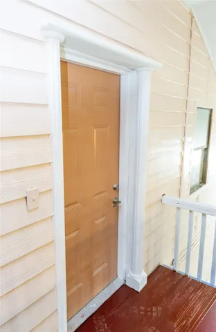 a view of an empty room with windows