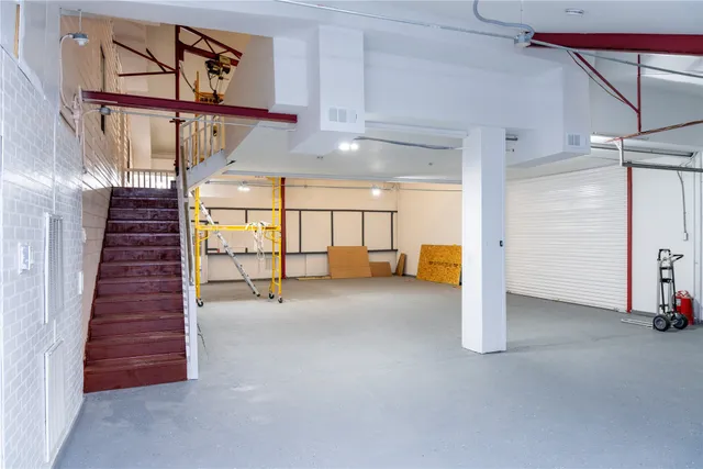 a utility room with two washing machine