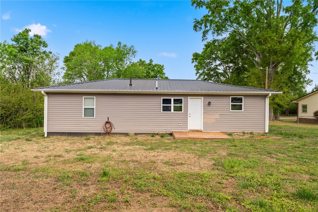 104 Leah Drive Pendleton, SC 29670 - Photo 21 of 23 This charming home offers a perfect blend of comfort and outdoor enjoyment with its serene backyard.