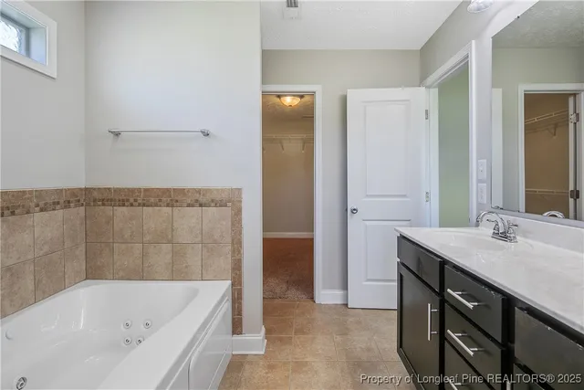 a bathroom with a bathtub and a sink