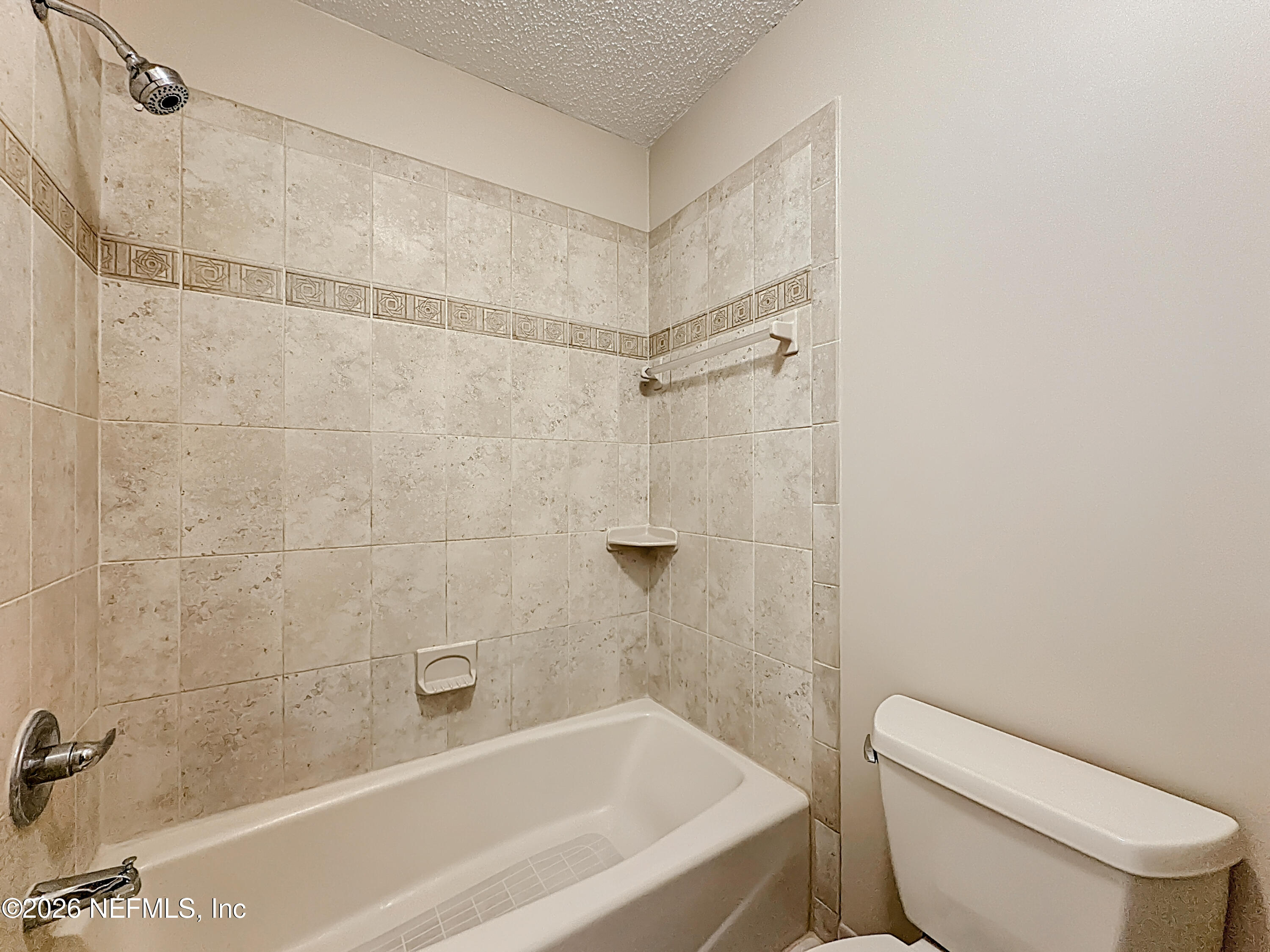 10298 Lone Star Road Jacksonville, FL 32225 - Photo 22 of 42 a bathroom with a toilet and shower