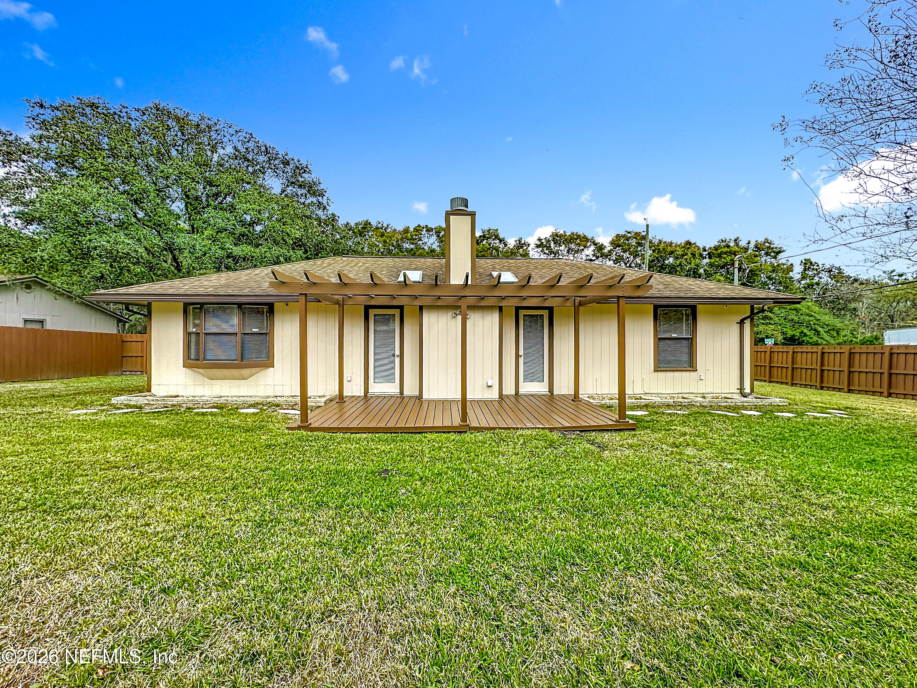 10298 Lone Star Road Jacksonville, FL 32225 - Photo 32 of 42 a front view of a house with a garden