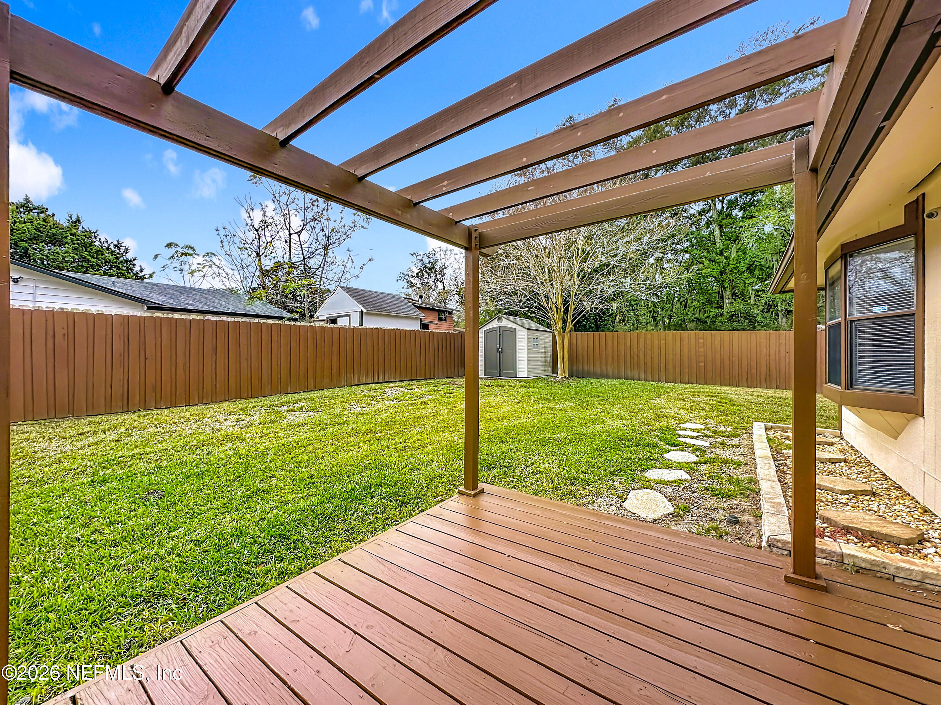 10298 Lone Star Road Jacksonville, FL 32225 - Photo 35 of 42 a view of a backyard with wooden floor