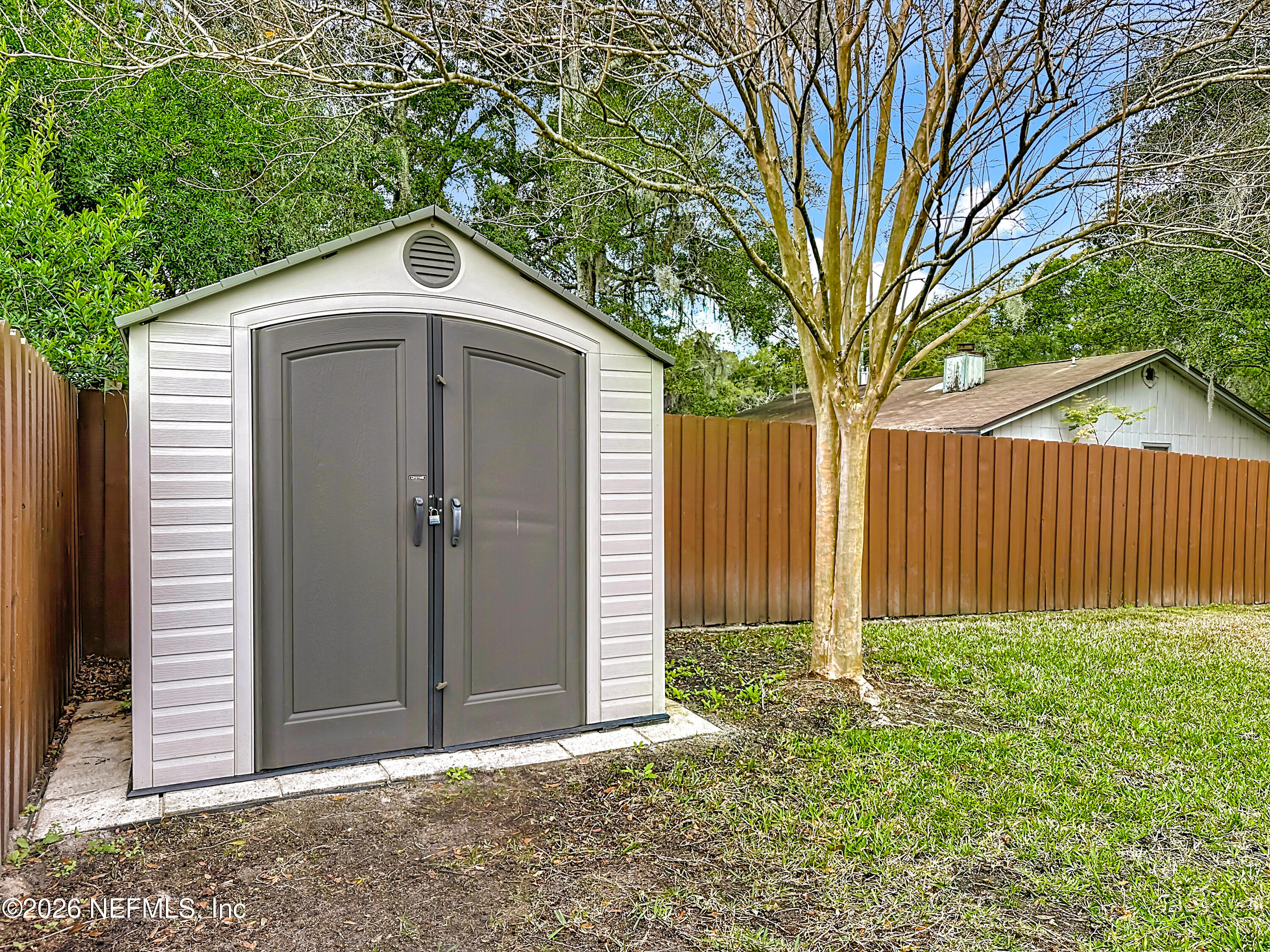 10298 Lone Star Road Jacksonville, FL 32225 - Photo 37 of 42 a house with a tree in front of it