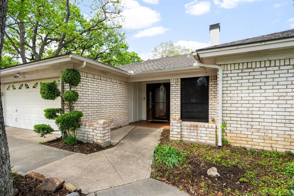 4011 Sumac Court Arlington, TX 76017 - Photo 1 of 1 a front view of a house with garden
