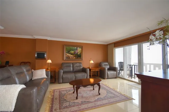 a living room with furniture and a rug