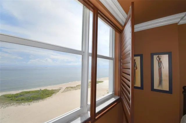 a bathroom with a granite countertop sink a toilet and a mirror