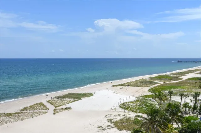 a kitchen with a table chairs sink and microwave