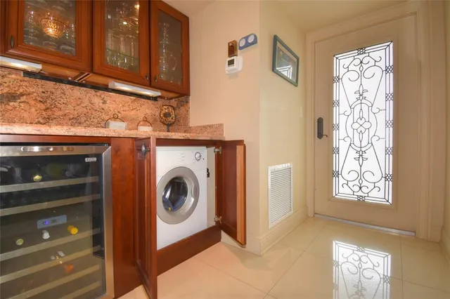 a kitchen with granite countertop a sink and wooden cabinets