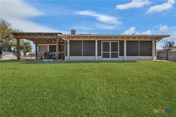 front view of a house with a yard and pathway