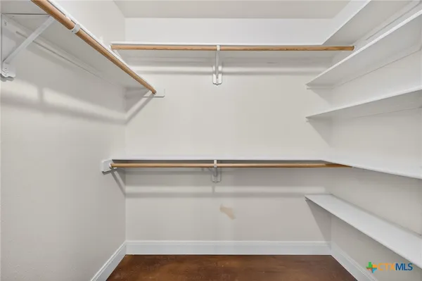 a view of an empty walk in closet