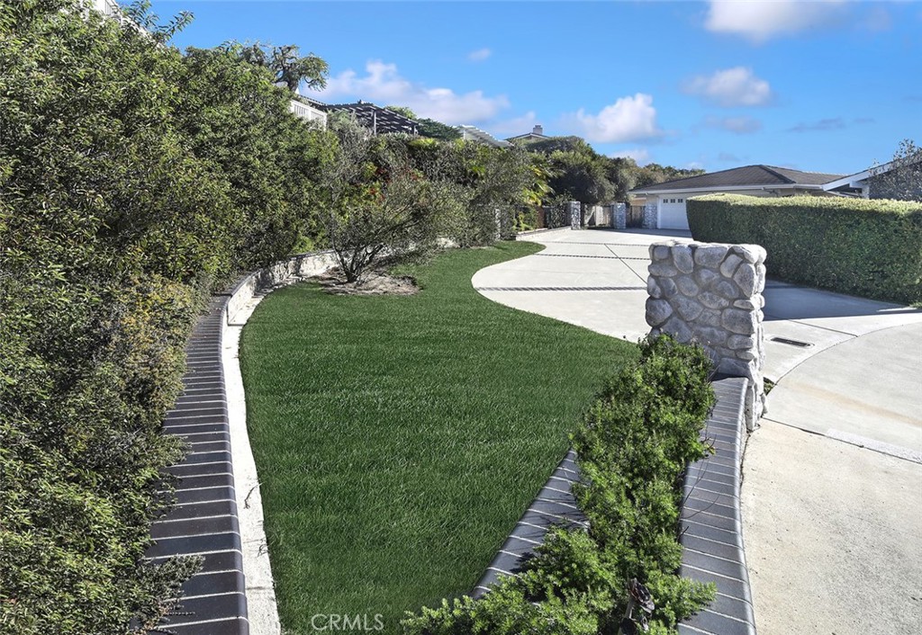 a view of a garden with a building in the background