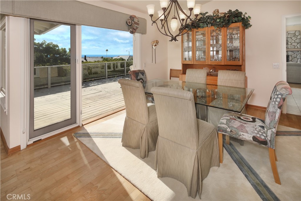 23262 Ellice Circle Dana Point, CA 92629 - Photo 6 of 10 a living room with furniture a floor to ceiling window and outdoor view
